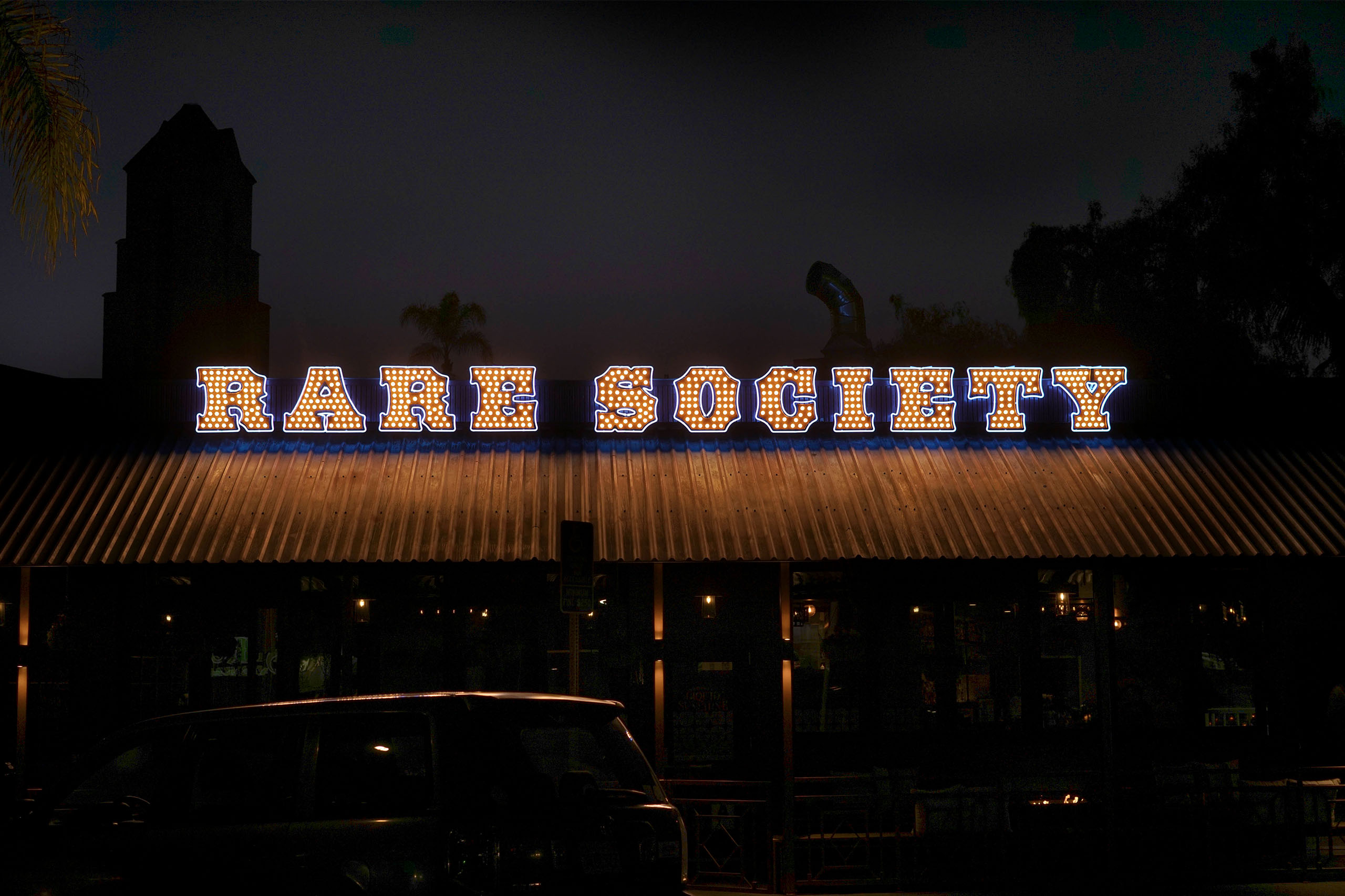 Rare Society sign lit